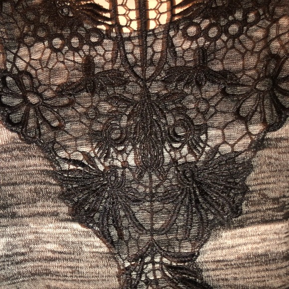 A black blouse. With a lacey design in the back - Picture 5 of 6